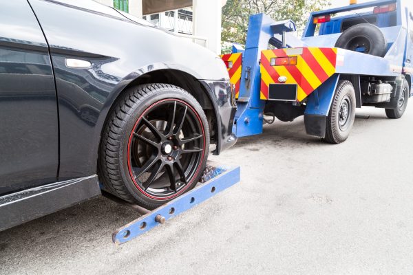 tow-truck-towing-a-broken-down-car-on-the-street-P46CHJA (2)